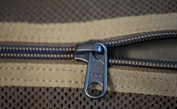 A close shot of a zipper on the Large Road Duffel.